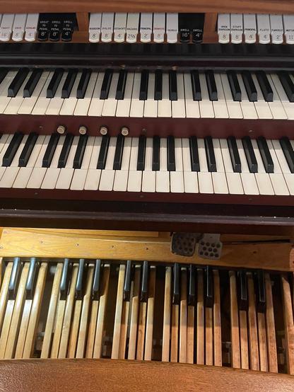 Stops, 2 manuals (keyboards), and pedals of a pipe organ.
