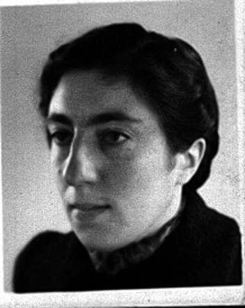 Black and white portrait of a woman, featuring a close-up view of the face, shown in partial profile.