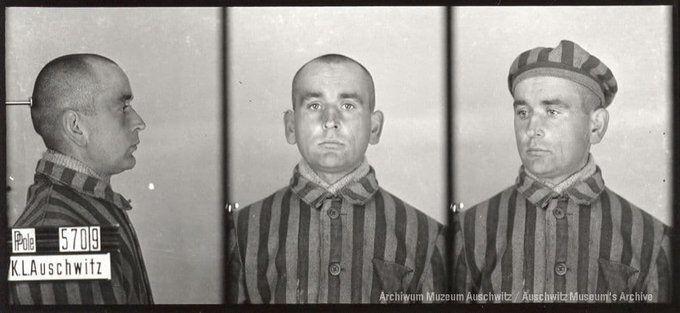 A mugshot registration photograph from Auschwitz. A man with a shaved head wearing a striped uniform photographed in three positions (profile and front with bare head and a photo with a slightly turned head with a hat on). The prisoner number is visible on a marking board on the left.