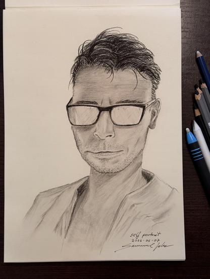 My first self portrait. With sun glasses on to avoid drawing eyes ;-)