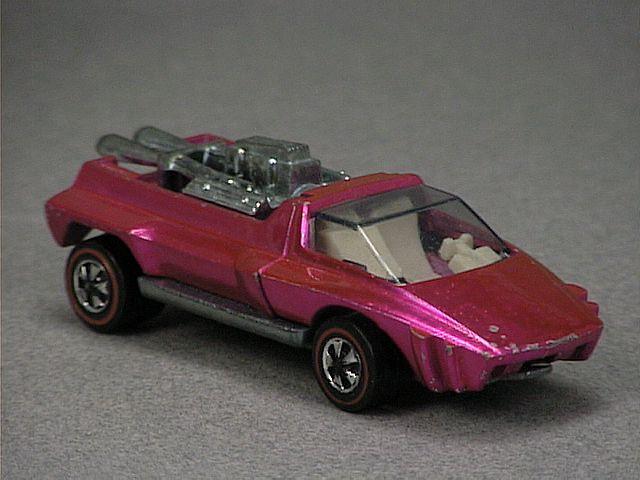 Released in 1971, Spectraflame Gold Hairy Hauler of 1971 Hot Wheels with Redline wheels. Notes: Canopy opens, unfinished metal engine block in rear. Packaging: 1971 Blister. Metal Body, Metal Base. Made in USA. Scarcity: 6/10