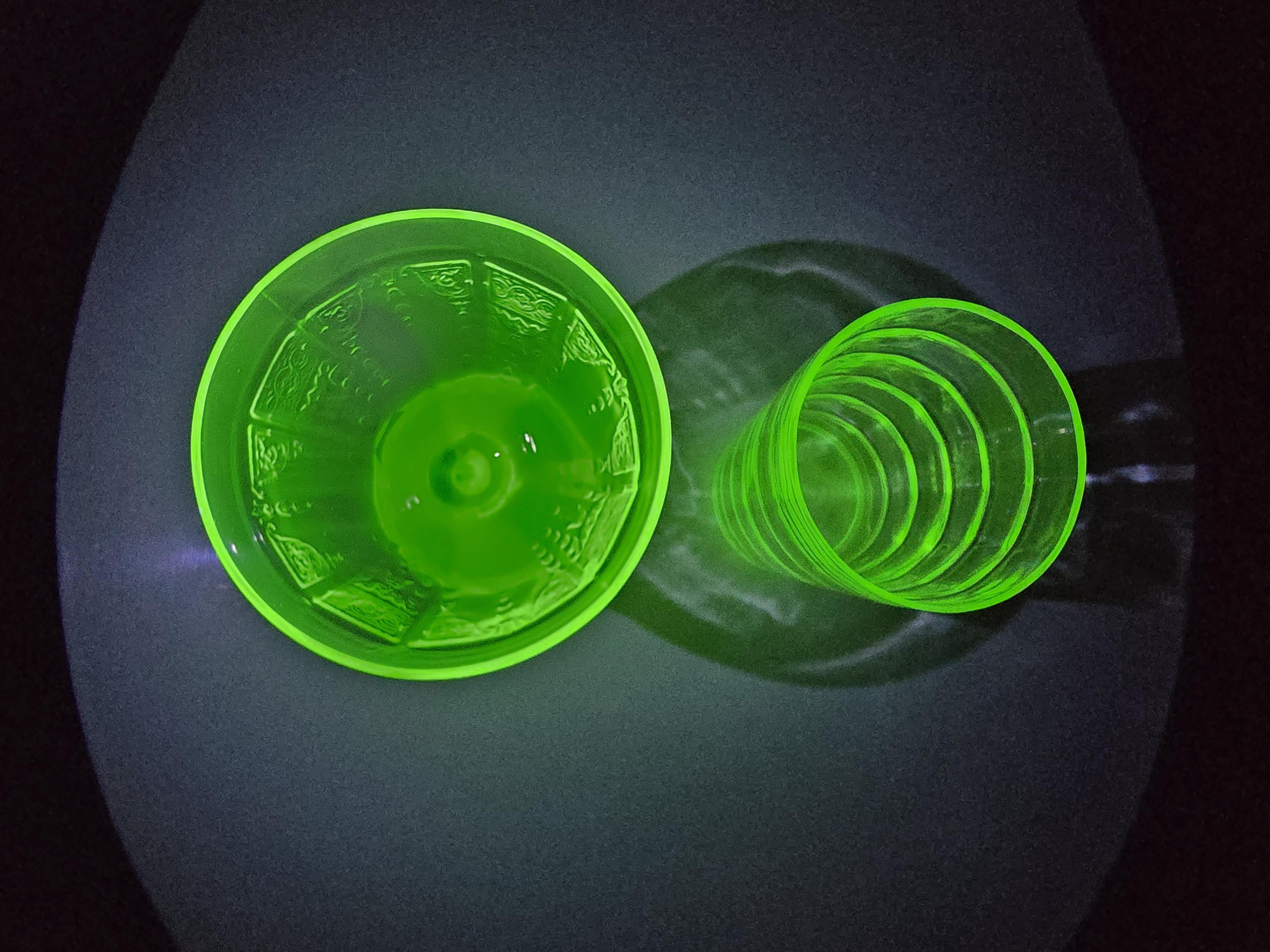 Uranium glass in UV light, top view.