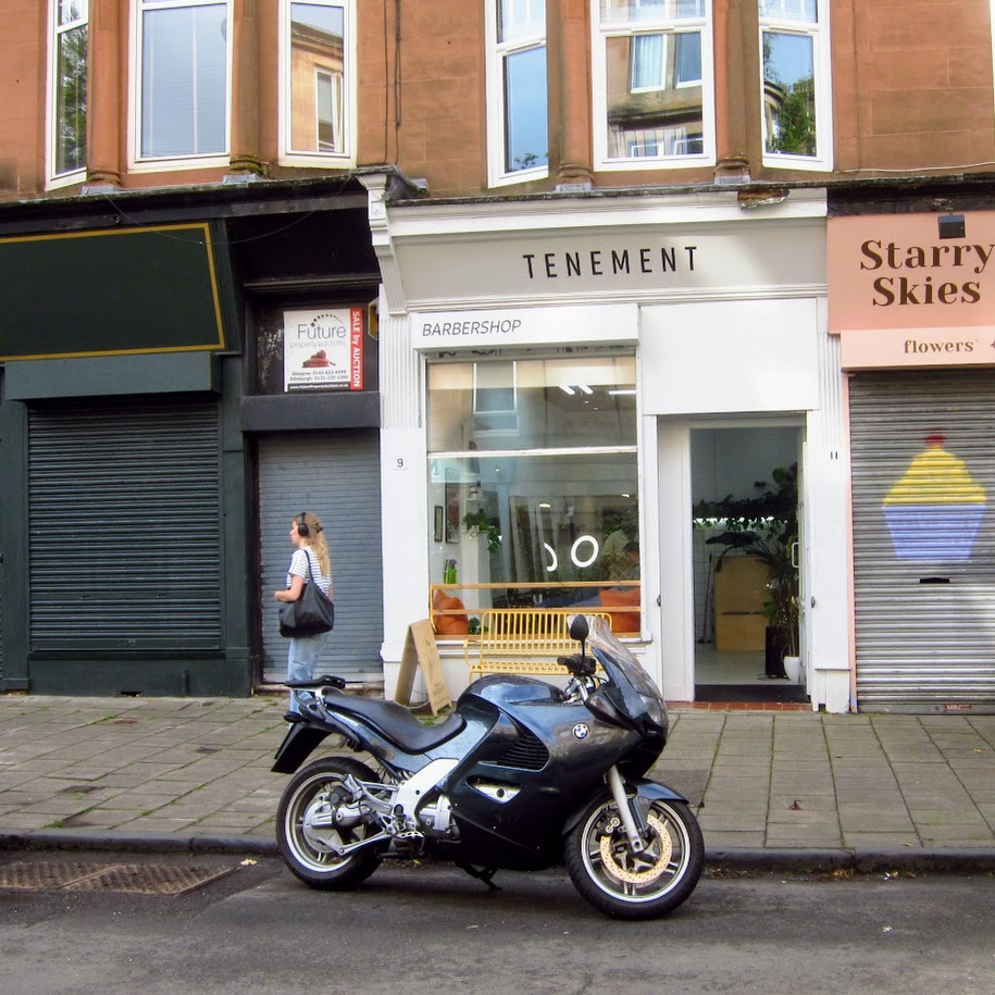 Motorbike in front of a Barbers Shop