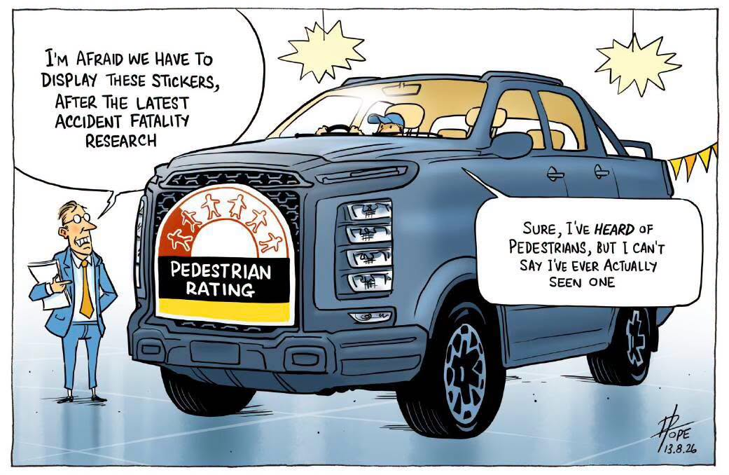 A car salesman stands in front of a behemoth pickup truck disclaiming a "safety rating" for the driver behind the wheel.