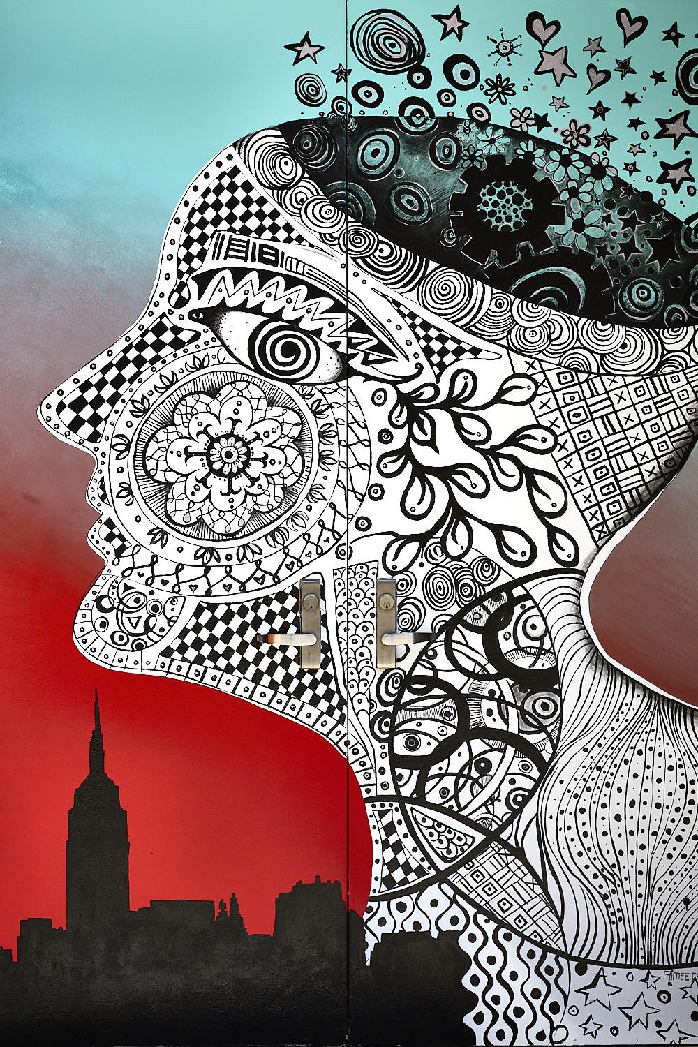This is a colour street photo in portrait format of the closed double doors to a New York City bar with an the intricate psychedelic artwork of a head and shoulders in the foreground with black stars, hearts and spirals rising from the top of the head and a black silhouette of NYC in the lower left corner against a red background that graduates into a pale blue at the top of the doors. 5th Ave, NYC (2013).