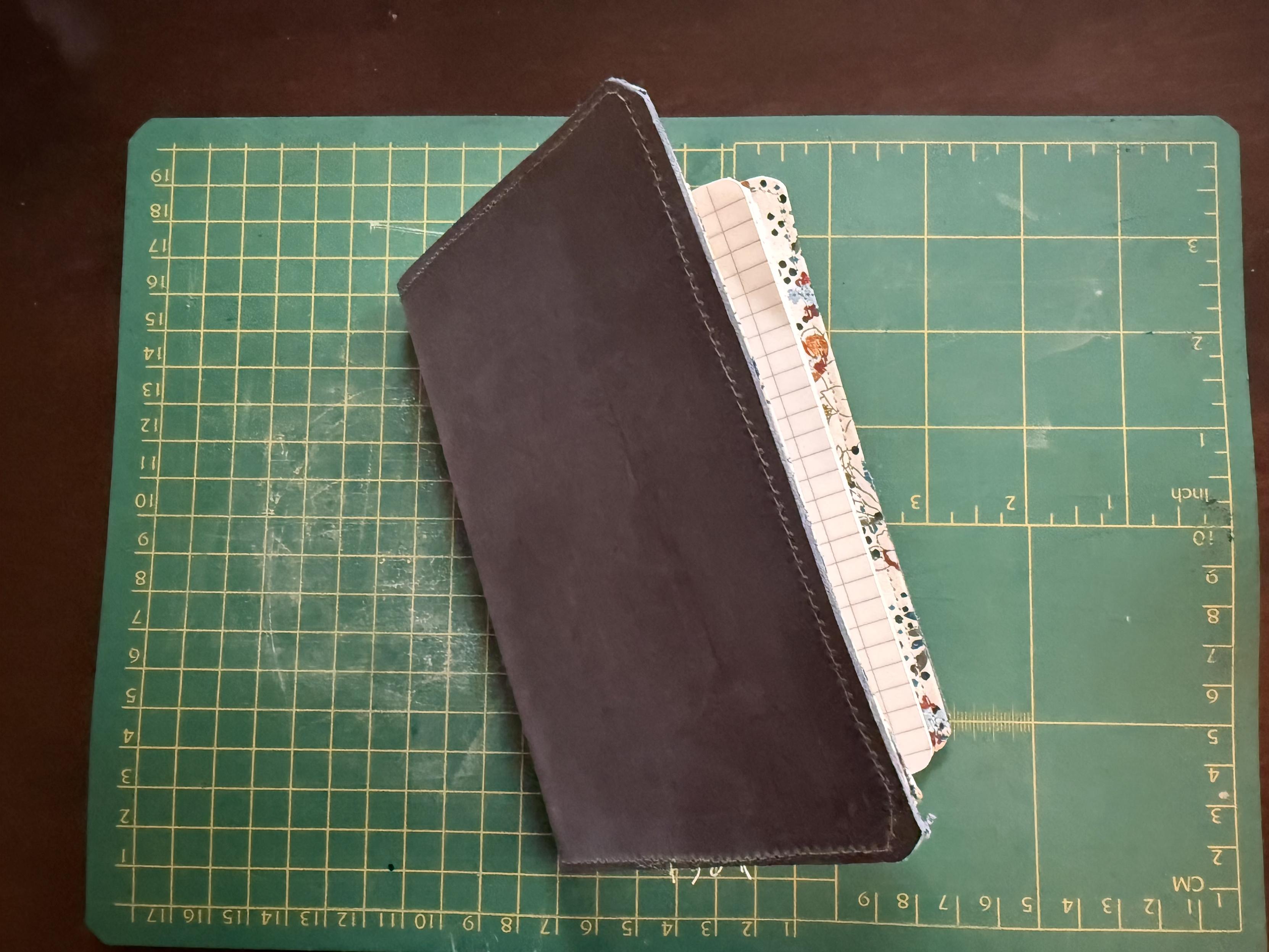 Pocket size notebook cover. Not used often enough to lay flat, but that will come