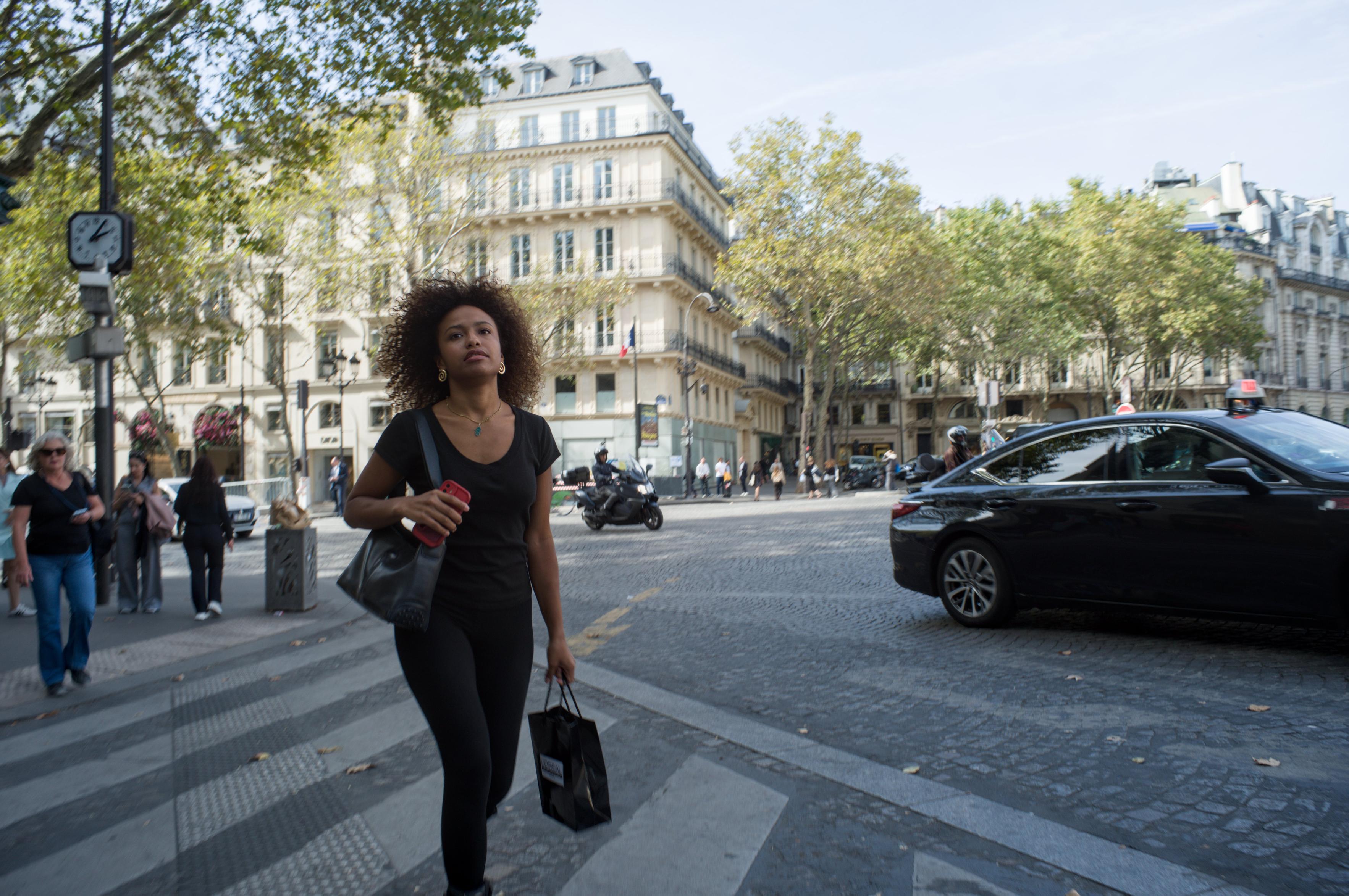A woman crossing the street