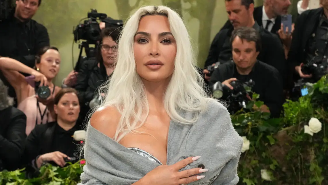 kim-kardashian-covers-“santa-baby,”-releases-bizarre-video-featuring-macaulay-culkin,-a-donkey-and-lots-of-cash